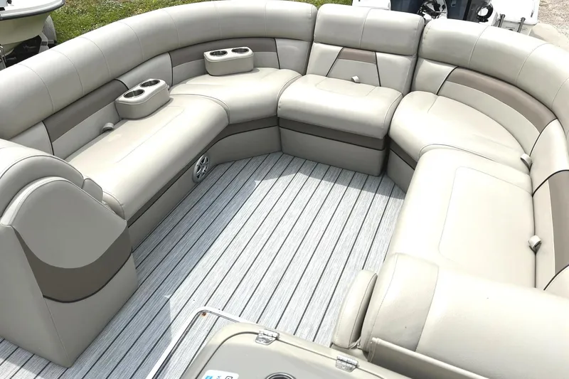 Slide: The Image of 2019 Trifecta 23C 3.0 pontoon boat with spacious seating and cup holders. - 12