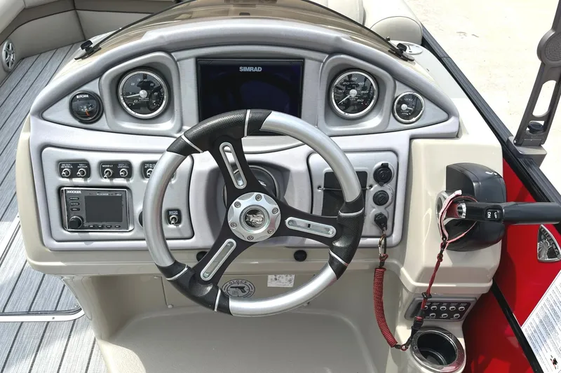 Slide: The Image of 2019 Trifecta 23C 3.0 boat dashboard with steering wheel and control panel. - 6