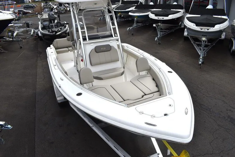 Slide: The Image of 2024 Key West 219 FS boat on display in a showroom. - 14