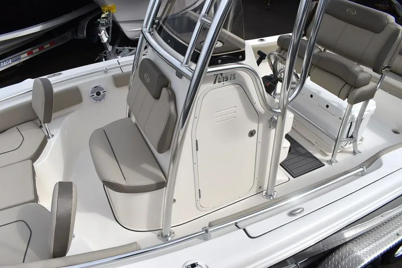Slide: The Image of 2024 Key West 219 FS boat interior with seating and console. - 16