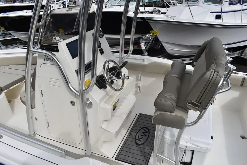 Slide: The Image of 2024 Key West 219 FS boat interior with helm and seating. - 19