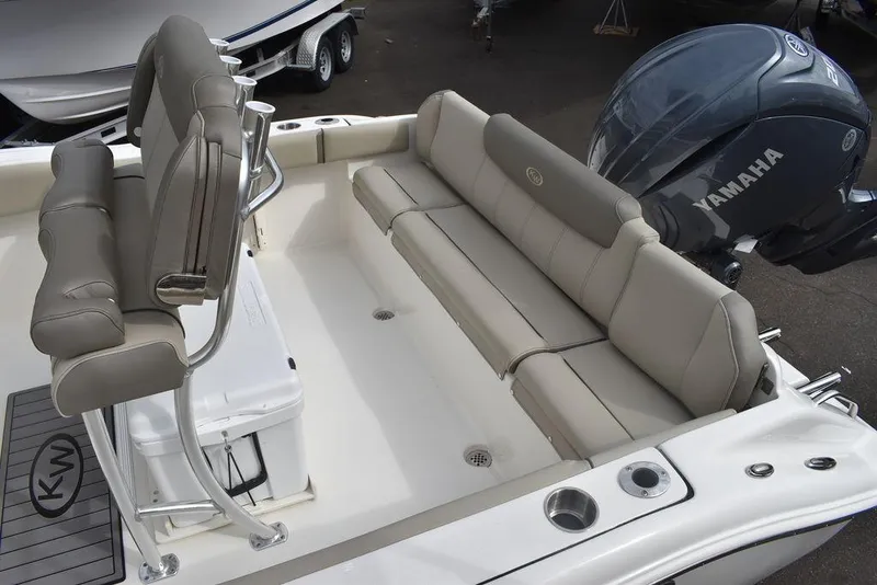 Slide: The Image of 2024 Key West 219 FS boat interior with Yamaha engine and cushioned seating. - 20