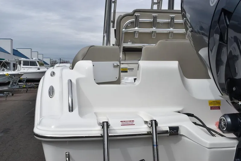 Slide: The Image of 2024 Key West 219 FS boat stern with ladder and seating. - 22
