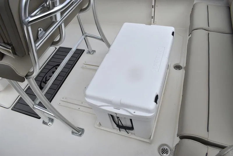 Slide: The Image of 2024 Key West 219 FS boat interior with cooler and seating. - 24