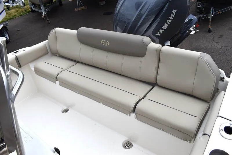 Slide: The Image of 2024 Key West 219 FS boat with cushioned seating and Yamaha engine. - 26