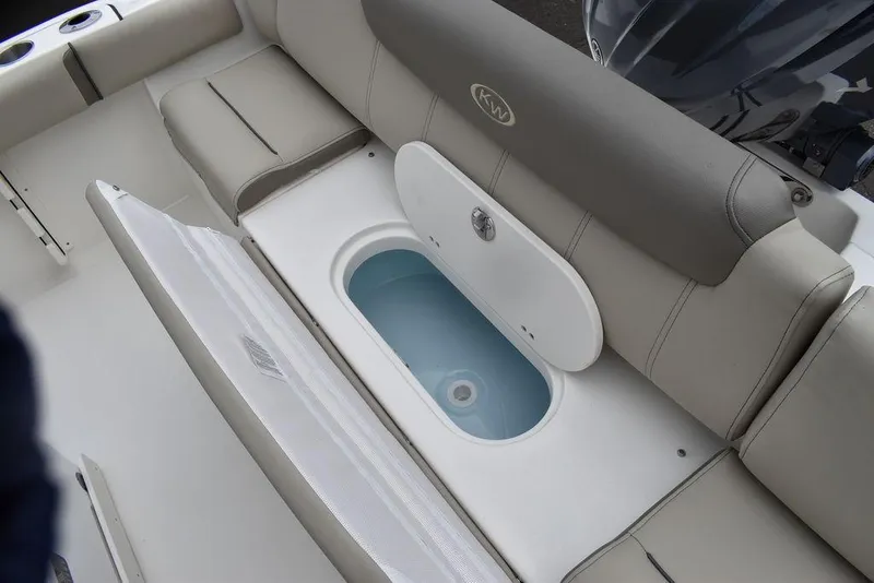 Slide: The Image of 2024 Key West 219 FS boat interior with open storage compartment. - 27