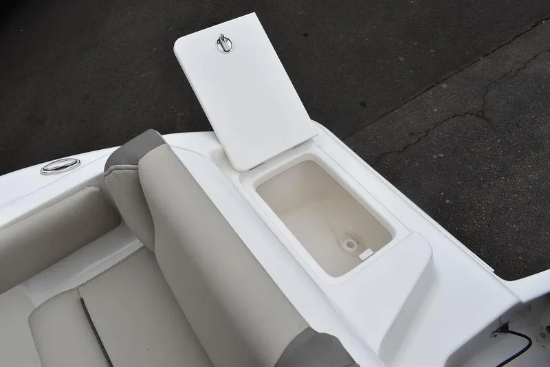 Slide: The Image of Open storage compartment on 2024 Key West 219 FS boat with cushioned seating. - 30