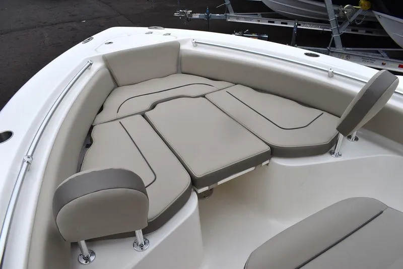 Slide: The Image of 2024 Key West 219 FS boat with cushioned seating area. - 46