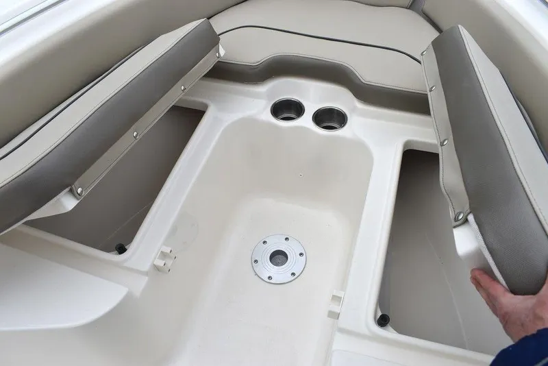 Slide: The Image of 2024 Key West 219 FS boat interior seating and storage compartments. - 48