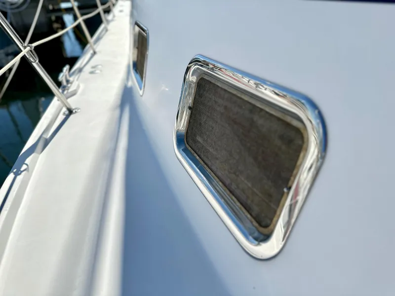 Slide: The Image of Close-up of 2004 Albin 35 Command Bridge window with chrome trim. - 15