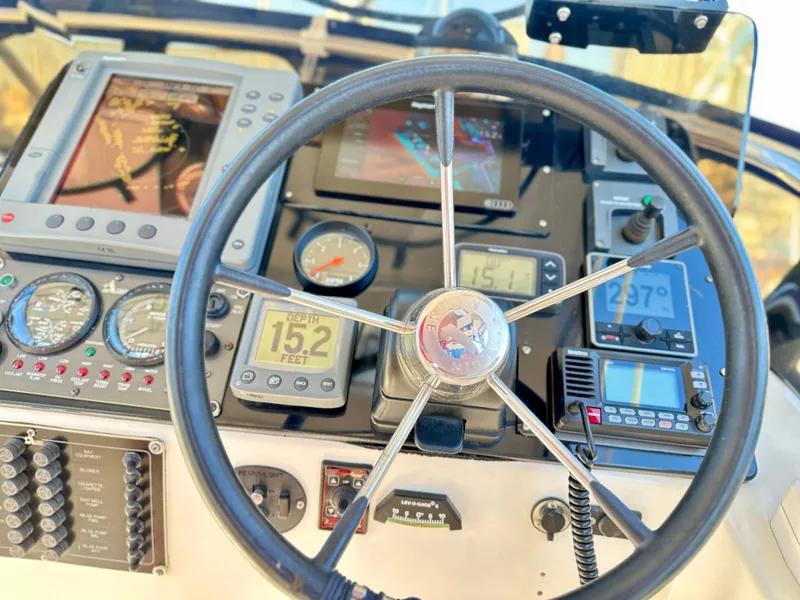 Slide: The Image of 2004 Albin 35 Command Bridge helm with navigation instruments and steering wheel. - 19