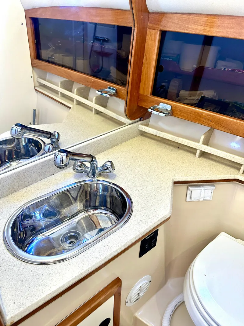 Slide: The Image of Bathroom interior of 2004 Albin 35 Command Bridge with sink and toilet. - 24