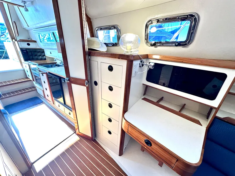 Slide: The Image of Interior of 2004 Albin 35 Command Bridge, featuring wood accents and modern amenities. - 31