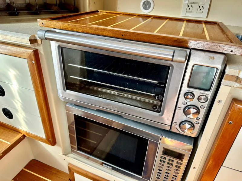 Slide: The Image of Toaster oven and microwave in 2004 Albin 35 Command Bridge kitchen area. - 36