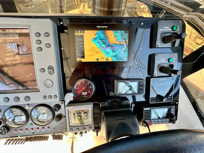 Slide: The Image of Control panel of a 2004 Albin 35 Command Bridge with navigation and monitoring instruments. - 43