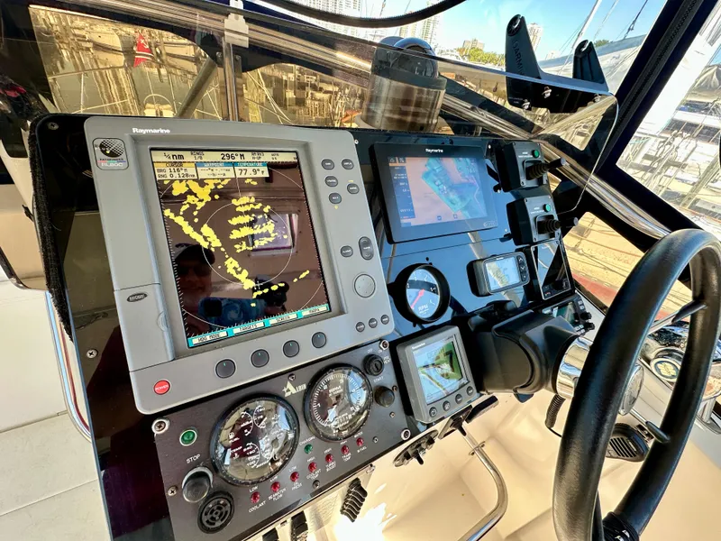 Slide: The Image of Control panel of a 2004 Albin 35 Command Bridge with navigation equipment. - 44