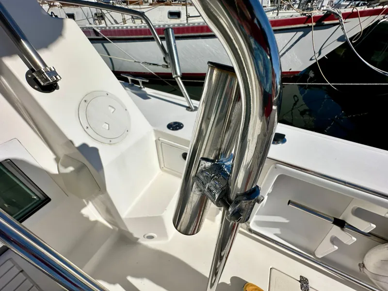 Slide: The Image of 2004 Albin 35 Command Bridge deck with stainless steel railing and rod holder. - 46