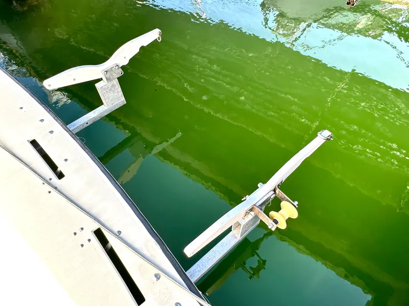 Slide: The Image of Albin 35 Command Bridge 2004 boat detail with green water reflection. - 48