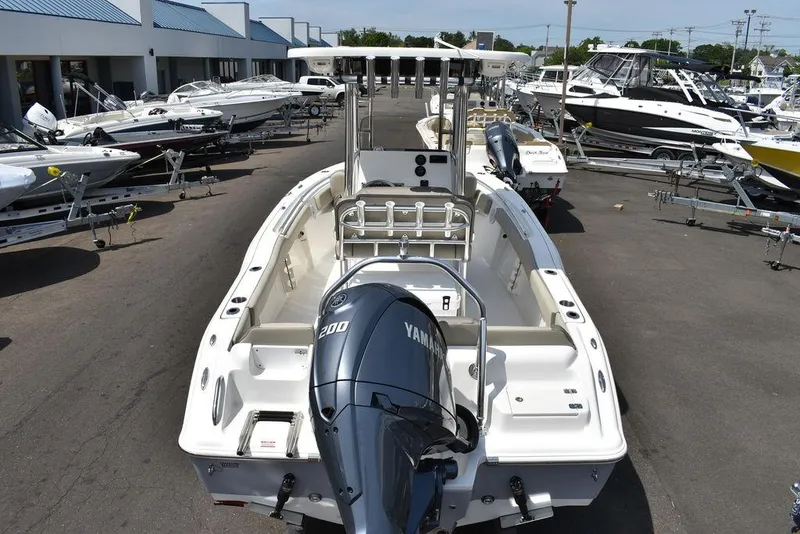 Slide: The Image of 2024 Key West 219 FS boat with Yamaha 200 engine at a dealership. - 10