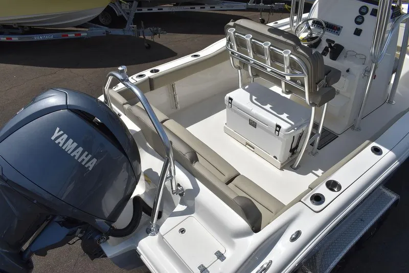Slide: The Image of 2024 Key West 219 FS boat with Yamaha outboard motor and seating area. - 13