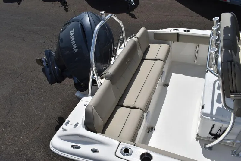 Slide: The Image of 2024 Key West 219 FS boat with Yamaha engine and beige seating. - 15