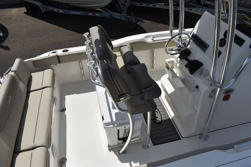 Slide: The Image of 2024 Key West 219 FS boat interior with seating and console. - 16