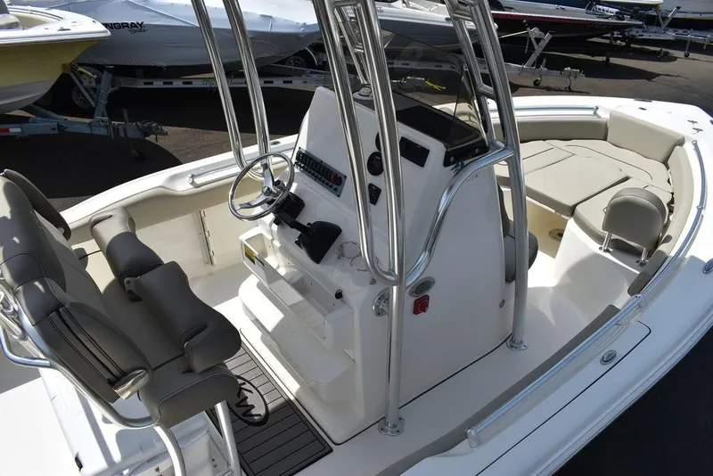 Slide: The Image of 2024 Key West 219 FS boat interior with helm station and seating. - 17