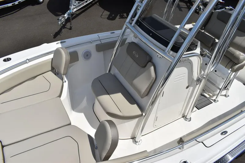 Slide: The Image of 2024 Key West 219 FS boat interior with cushioned seating and console. - 21