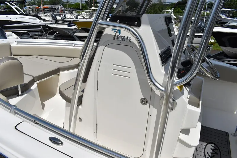Slide: The Image of 2024 Key West 219 FS boat interior with seating and console. - 23