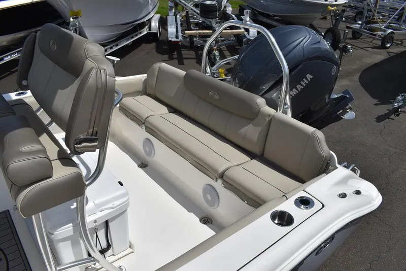 Slide: The Image of 2024 Key West 219 FS boat interior with seating and Yamaha engine. - 25