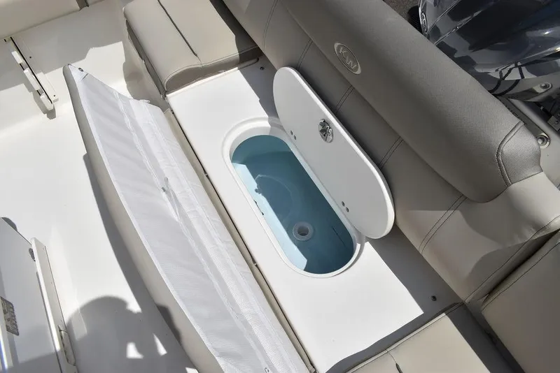 Slide: The Image of 2024 Key West 219 FS boat with open storage compartment. - 29