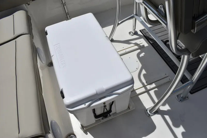 Slide: The Image of 2024 Key West 219 FS boat interior with cooler and seating. - 34