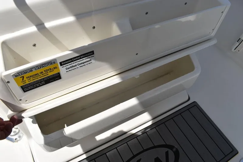 Slide: The Image of 2024 Key West 219 FS boat storage compartment with capacity label. - 39