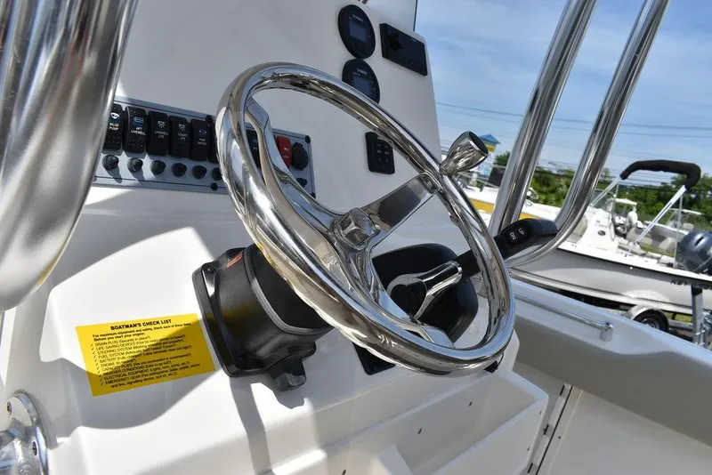 Slide: The Image of 2024 Key West 219 FS boat steering wheel and control panel. - 40