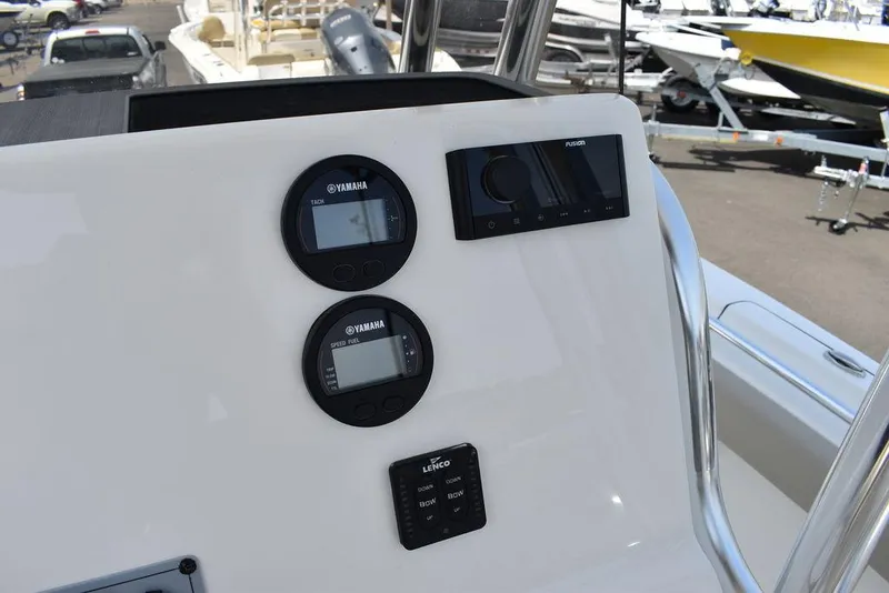 Slide: The Image of 2024 Key West 219 FS boat dashboard with Yamaha gauges and controls. - 41