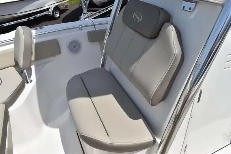 Slide: The Image of 2024 Key West 219 FS boat seating area with cushioned seats and backrest. - 46