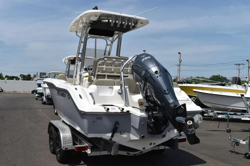 Slide: The Image of 2024 Key West 219 FS boat with outboard motor on trailer. - 6