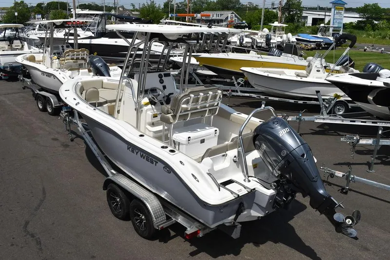 Slide: The Image of 2024 Key West 219 FS boat on trailer in a marina. - 8