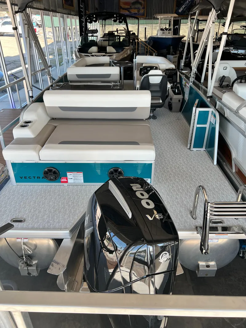 Slide: The Image of 2024 Princecraft Vectra 23 RL pontoon boat interior with seating and table. - 10