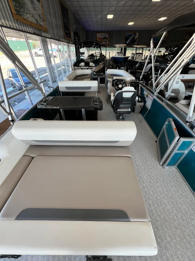Slide: The Image of 2024 Princecraft Vectra 23 RL pontoon boat interior with seating and table. - 11