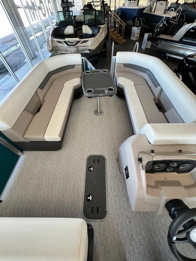 Slide: The Image of 2024 Princecraft Vectra 23 RL boat interior with modern seating and steering console. - 14