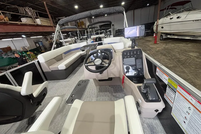 Slide: The Image of 2024 Princecraft Vectra 23 RL pontoon boat interior with steering console and seating. - 19
