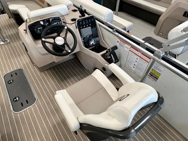 Slide: The Image of 2024 Princecraft Vectra 23 RL pontoon boat in a warehouse setting. - 5