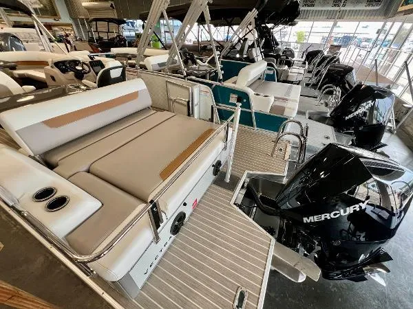 Slide: The Image of 2024 Princecraft Vectra 23 RL pontoon boat in a warehouse setting. - 8