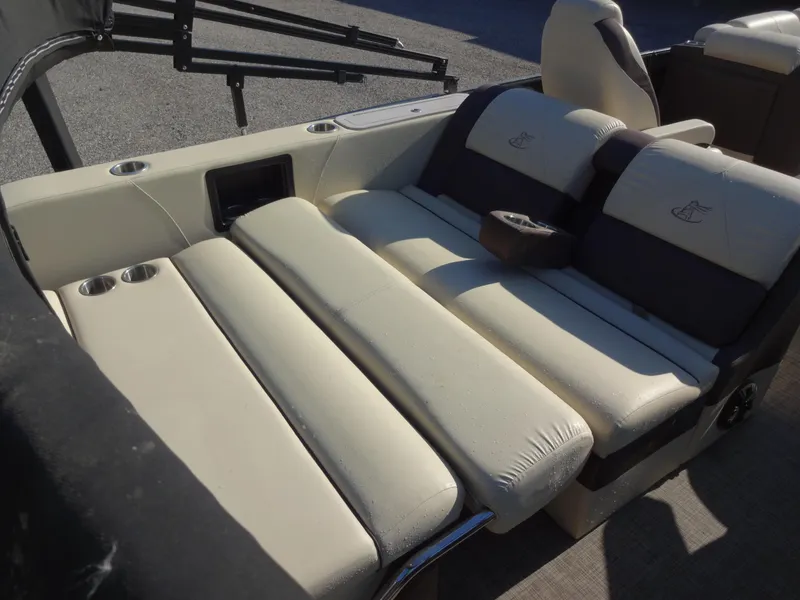 Slide: The Image of 2017 Misty Harbor SL-2685 boat interior with beige seating and cup holders. - 18