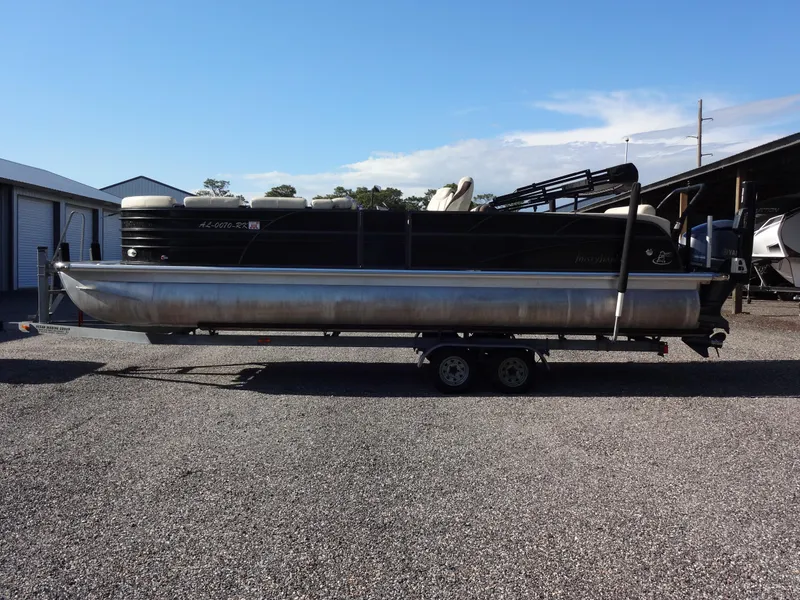Slide: The Image of 2017 Misty Harbor SL-2685 pontoon boat on a trailer in a parking lot. - 6