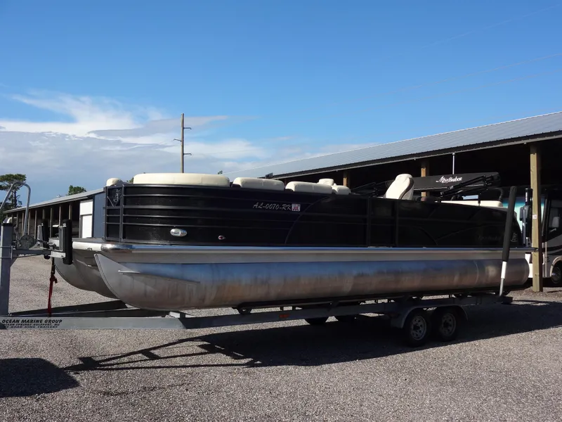 Slide: The Image of 2017 Misty Harbor SL-2685 pontoon boat on a trailer in a marina. - 7