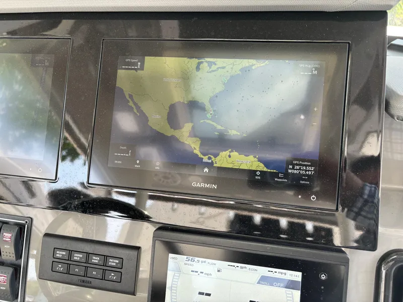 Slide: The Image of Garmin navigation system on 2022 Pursuit S 288 boat dashboard. - 14