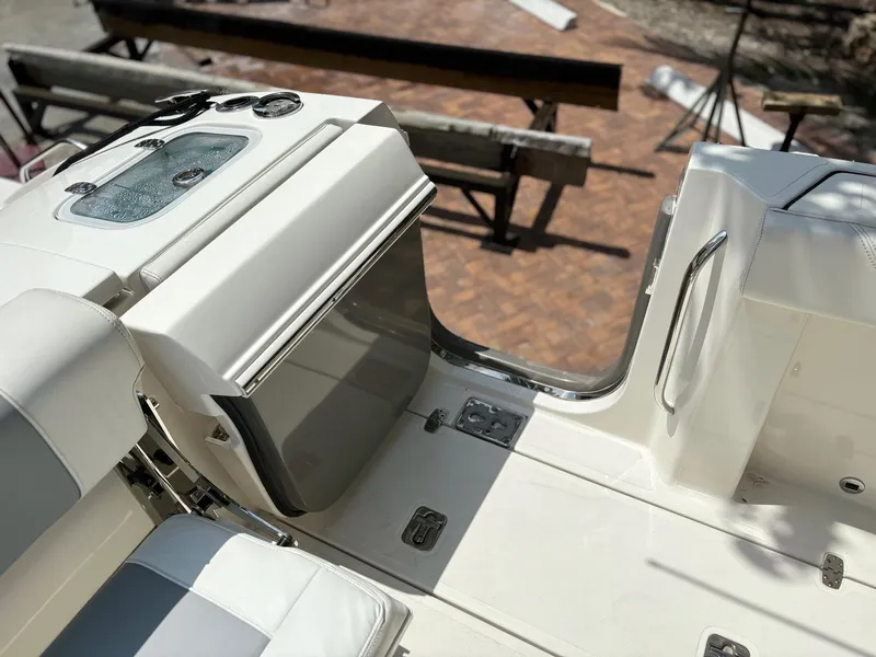 Slide: The Image of 2022 Pursuit S 288 boat interior with seating and storage compartments. - 18