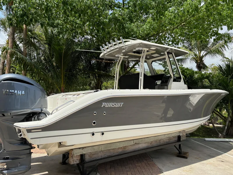 Slide: The Image of 2022 Pursuit S 288 boat on a trailer with Yamaha outboard motor. - 6